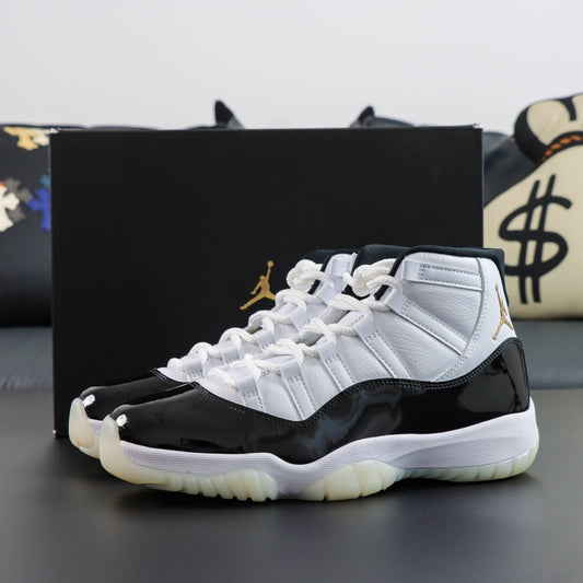 Air Jordan 11  Retro DMP Gratitude 2023.  Black and white sneakers with a Jordan logo on a dark surface