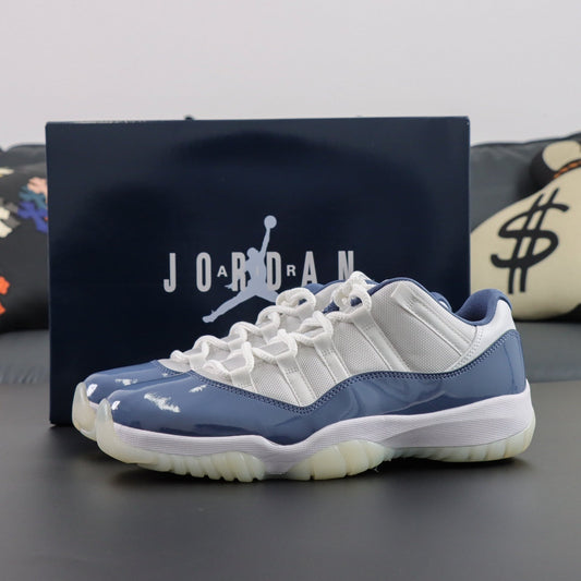Air Jordan 11  Retro Low Diffused. Blue and white sneaker with Jordan branding in the background