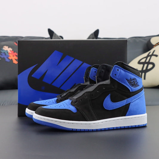 Air Jordan 1 Retro High OG Royal Blue Edition. Black and blue high-top sneakers with a Nike box in the background