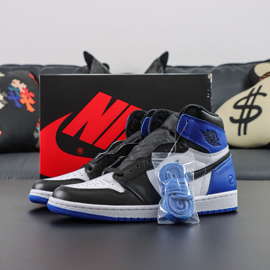 Air Jordan 1 Retro OG High Fragments. Black, white, and blue sneakers with a Nike box in the background