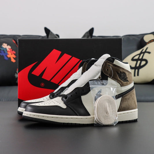 Air Jordan 1 Retro OG High Mocha. Pair of black, white, and brown sneakers with a Nike box in the background.