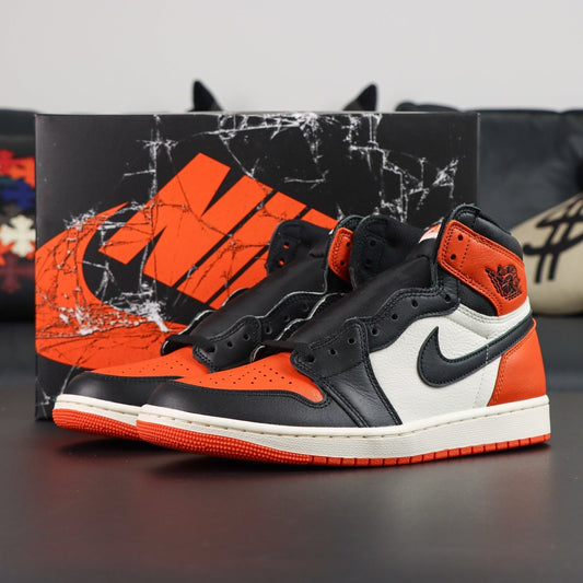 Air Jordan 1 Retro OG High Shattered Backboard 2025. Black and orange sneakers with a Nike logo on a dark surface